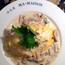 Omu rice with mushroom cream sauce.
