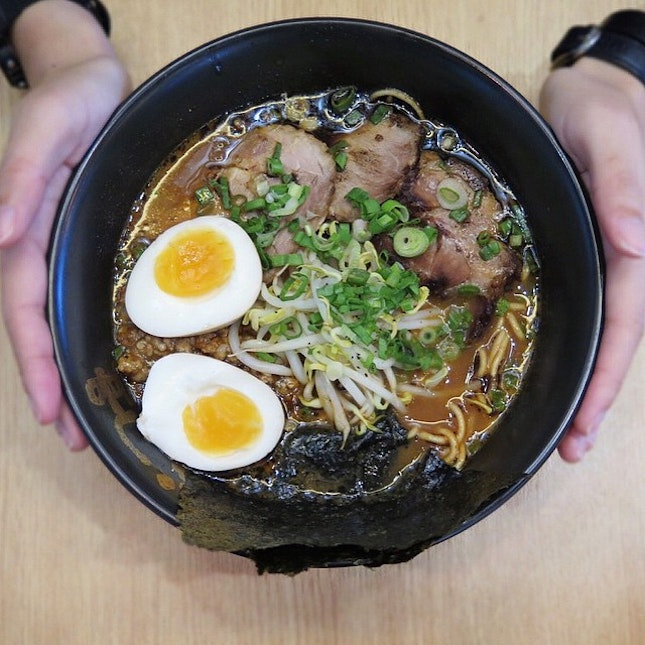 A bowl of hot ramen with meaty companions and comforting egg is always a rainy day saviour.