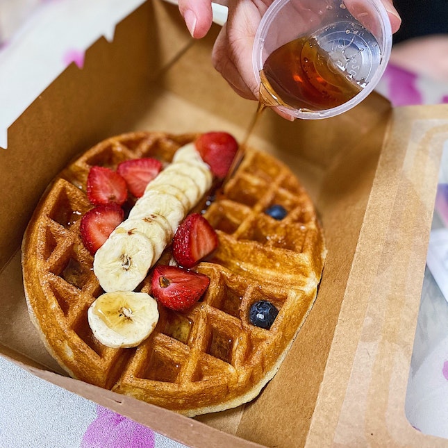 Buttermilk waffles with maple syrup and fresh fruits ($11.50).